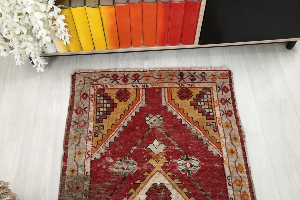 Overhead view showing the top half of the rug's design and color variations