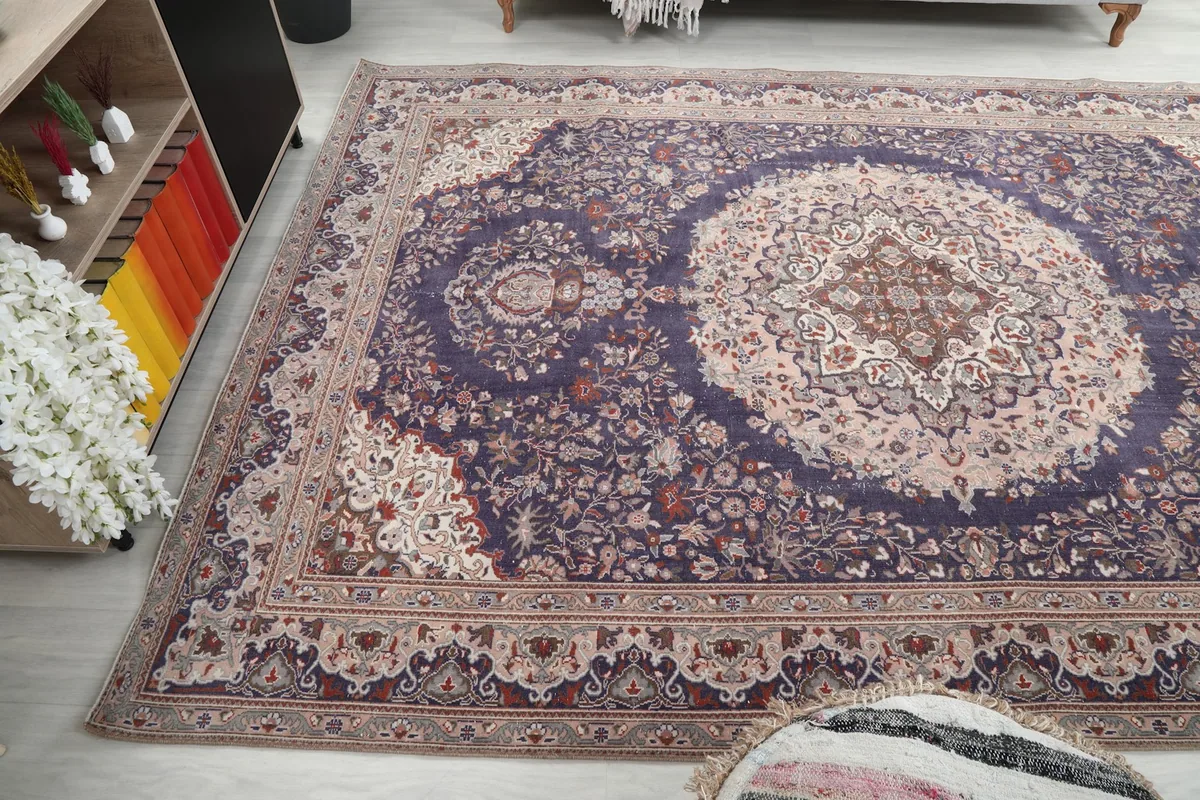 Wide shot of the rug in a room, emphasizing its large size and floor coverage