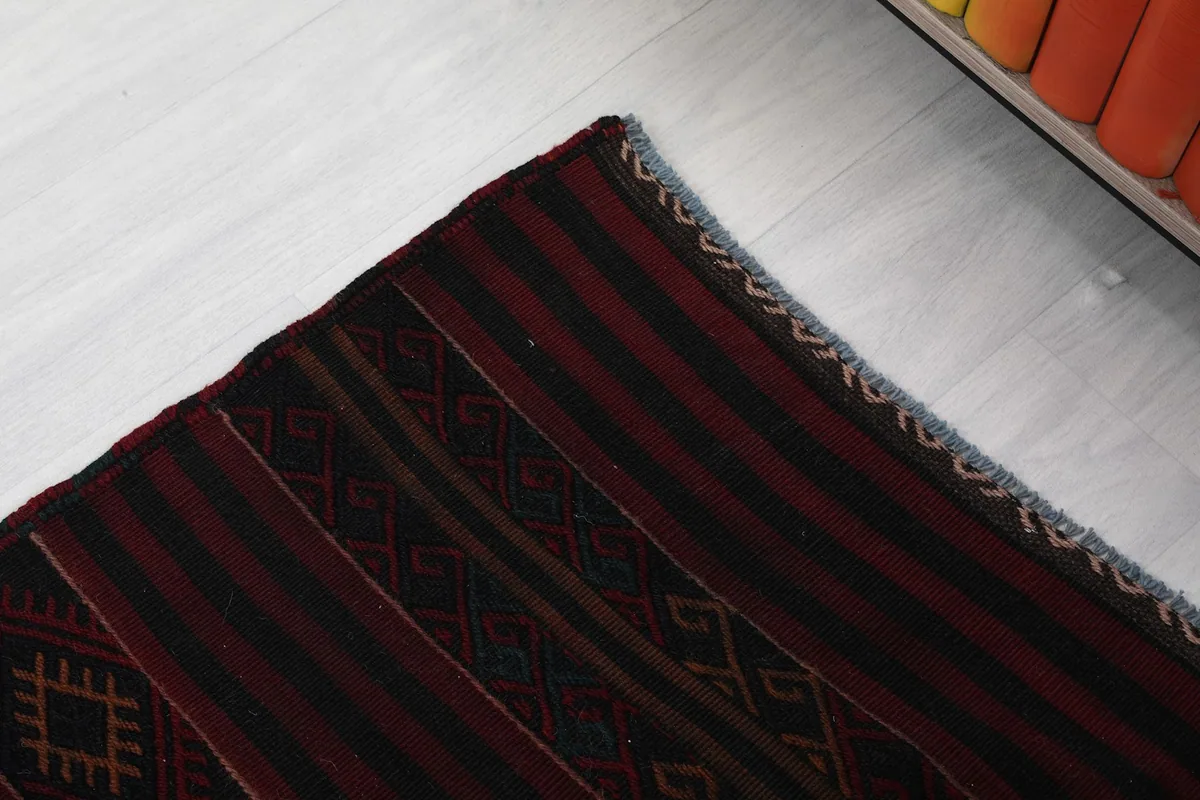 Corner detail showing the edge finish and a subtle blue accent in the weave