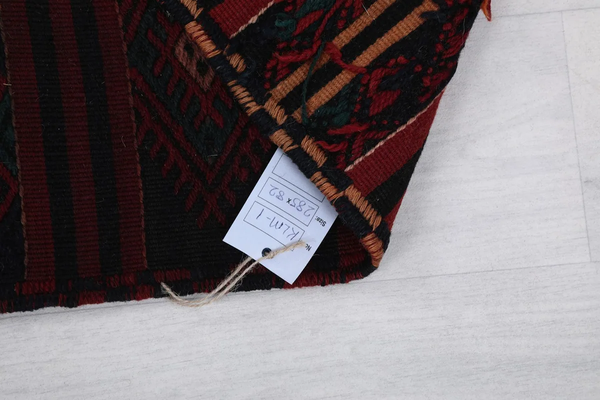 Tag attached to the rug, showing size and product information