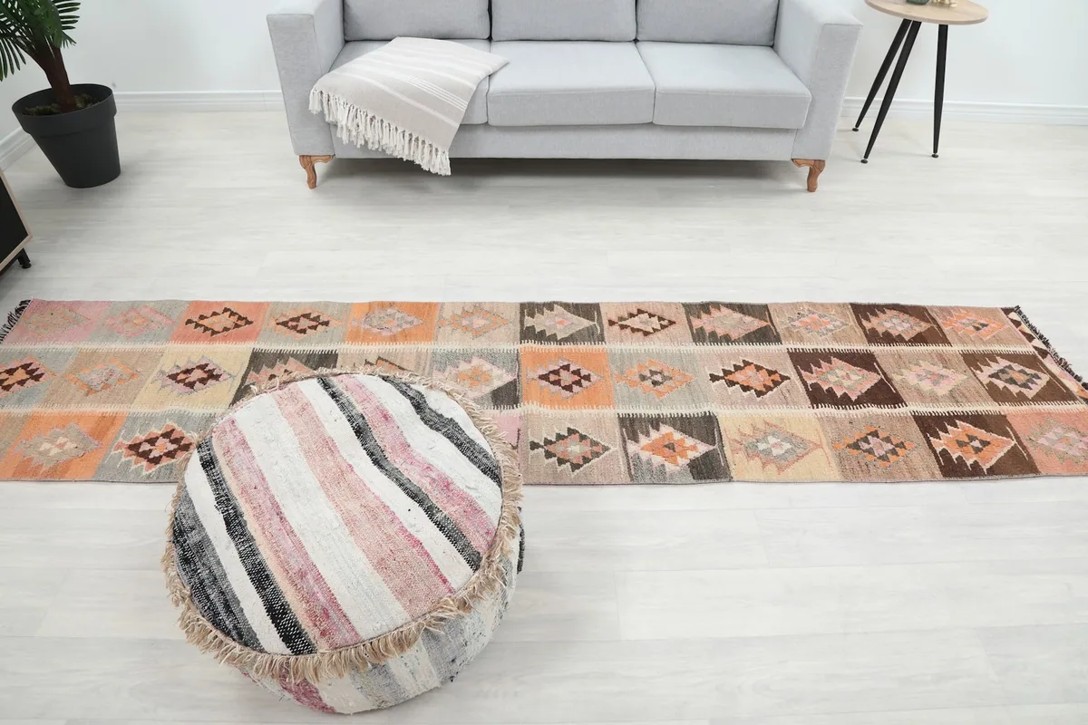 Runner rug laid out in a living area, providing a sense of its size and design in a spacious setting.