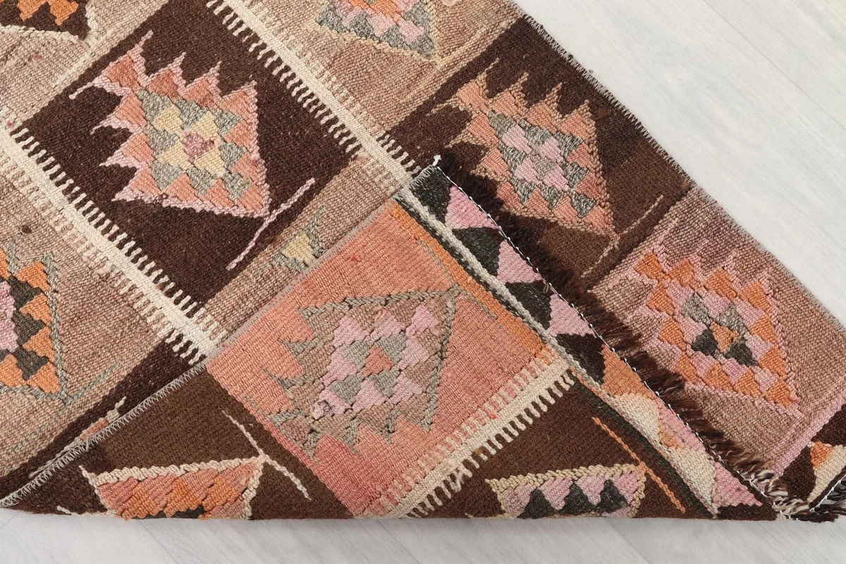 View of the back of the runner, revealing the cotton foundation and hand-knotted construction.