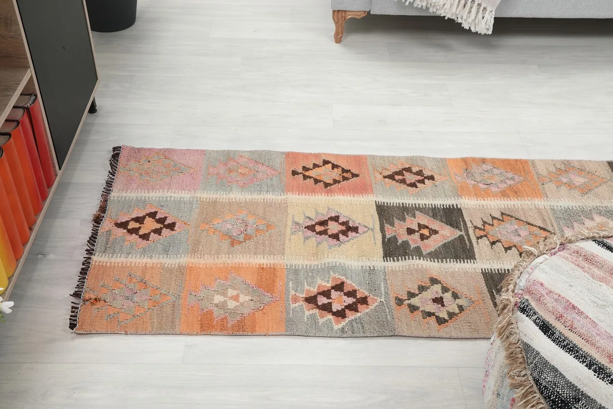 Overhead view of the runner on a light floor, showing the full length and pattern repeat from above.