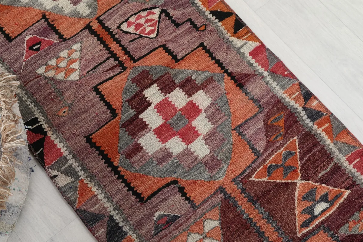 Angled view highlighting the central medallion-like geometric patterns and border details