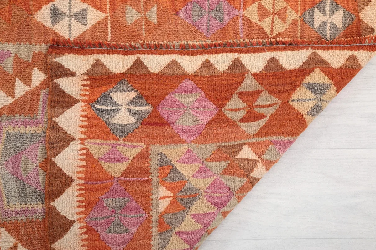 Underside of the rug, showing the cotton foundation and the consistent hand-knotted structure