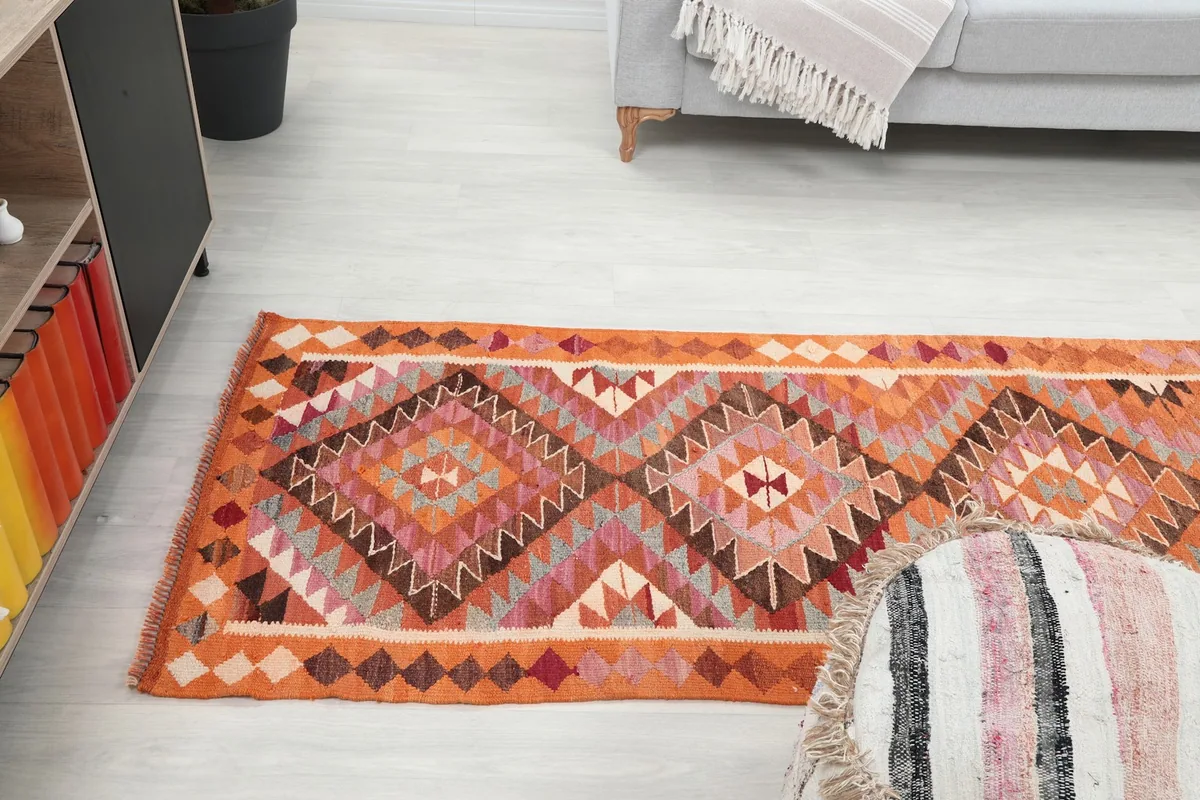 View of the runner stretching along the floor, showing its length in a home setting