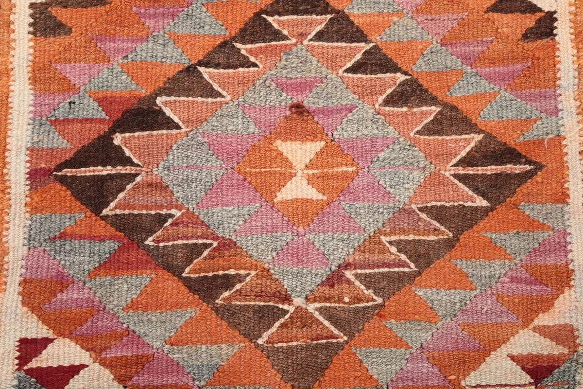 Overhead detail of a prominent diamond-shaped motif with intricate patterns