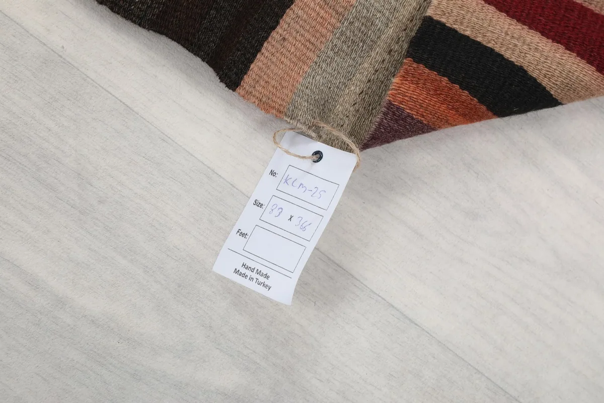 Product tag attached to the rug, displaying size information and confirming 'Hand Made in Turkey'.