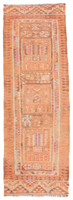 Full overhead view of the 3'1" x 9'6" rust orange tribal Anatolian runner rug on a white background.