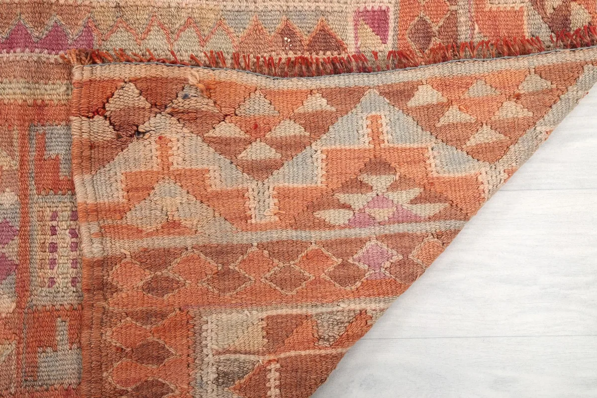 Underside of the rug, showing the hand-knotted construction and the even texture of the cotton foundation.