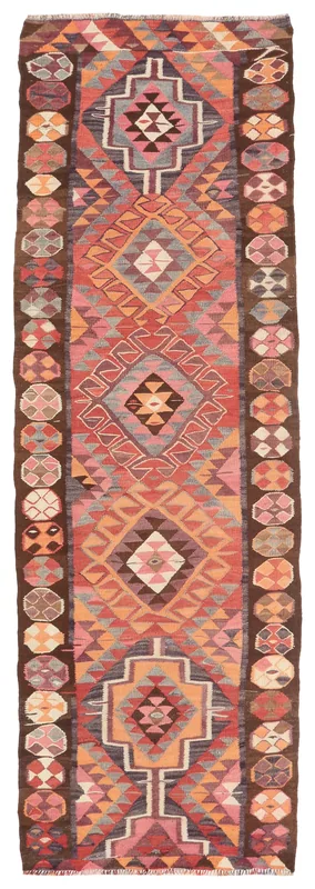 Full top view of the 3'4" x 10'8" vintage Anatolian runner rug with rust, orange, and brown geometric patterns.