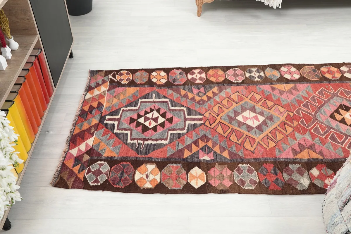 Overhead view of a section of the runner rug, displaying its full width and intricate patterns.