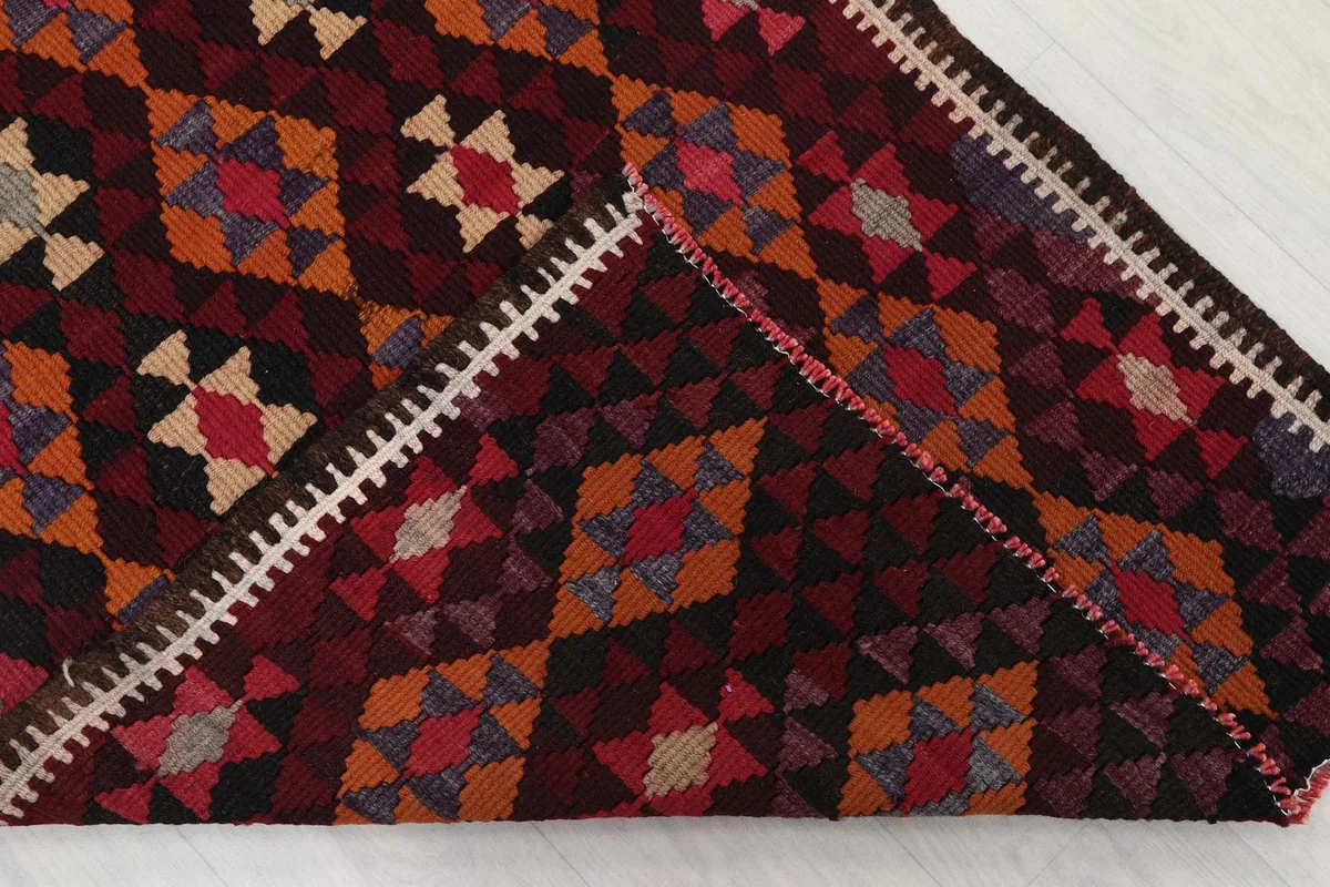 Close-up of the back of the hand-knotted rug, revealing the cotton foundation and knotting.