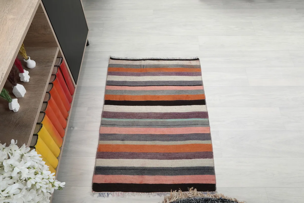 Overhead view of the rug on a light floor, showing its full rectangular shape
