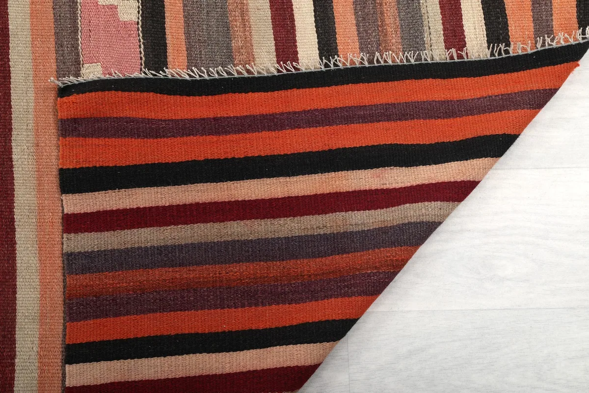 Folded section of the rug, revealing the dense hand-knotted wool pile and cotton foundation