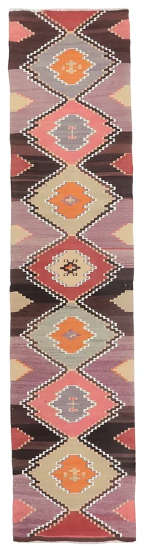 Full top view of the 2'6" x 10'11" vintage Anatolian runner with brown, rose, and tan geometric patterns