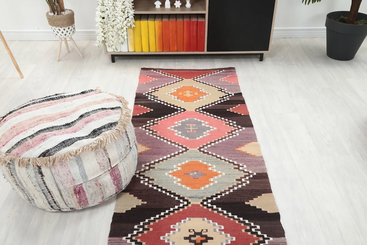 Overhead shot of the runner in a room setting, emphasizing its length and vibrant geometric design