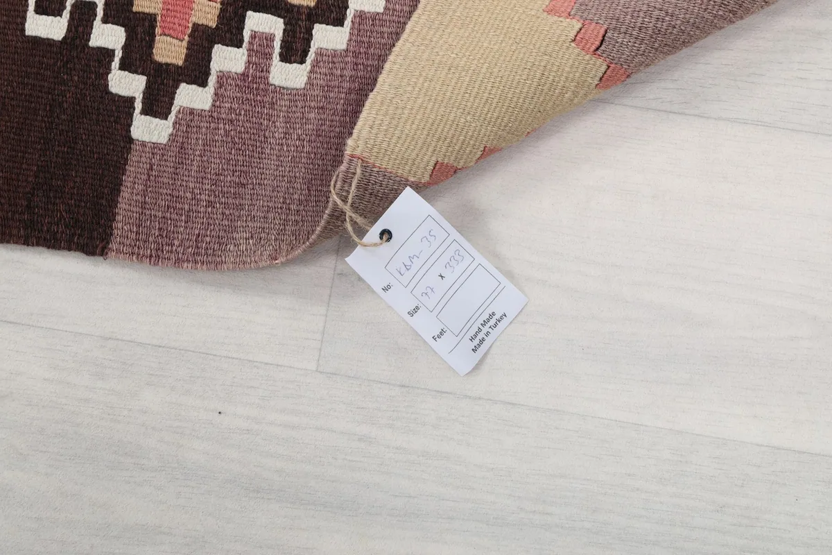 Corner of the runner with the product tag, indicating its origin and material