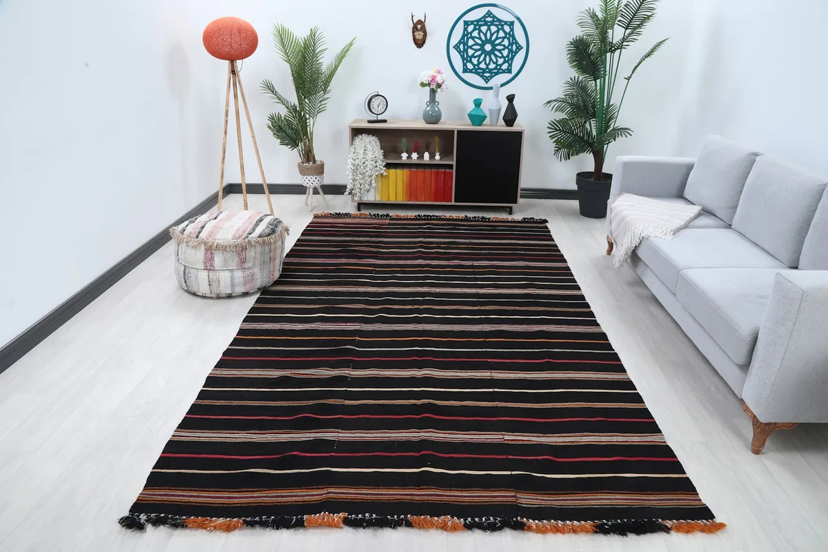 Black striped rug displayed in a modern living room setting
