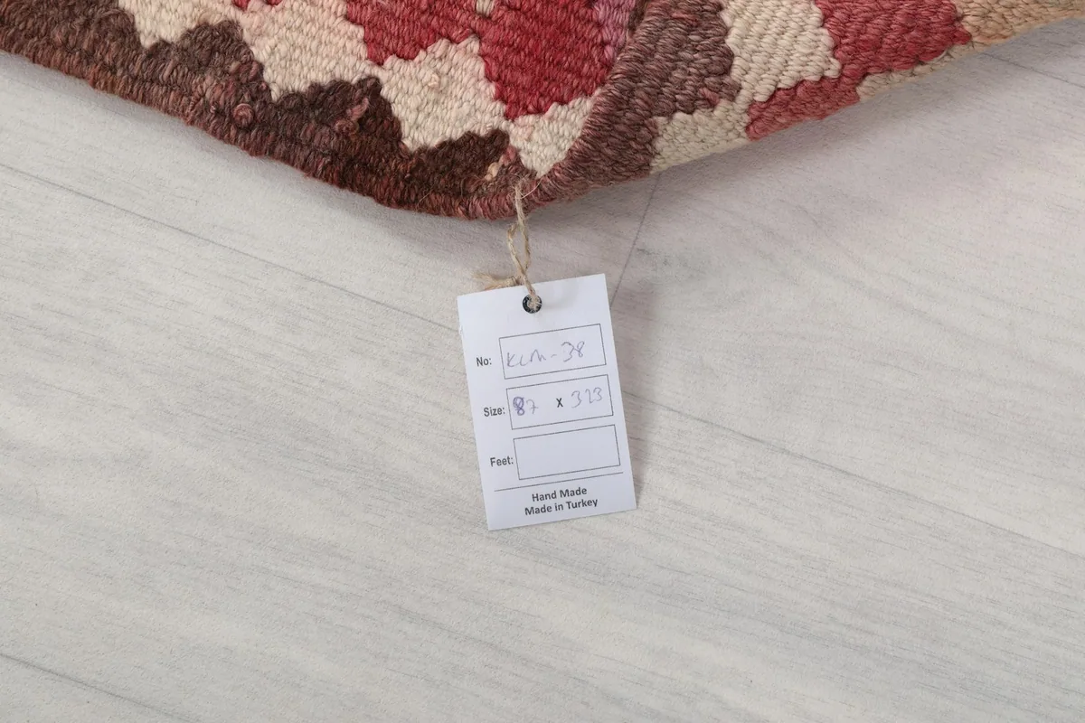 Product tag attached to the rug, showing size and origin information