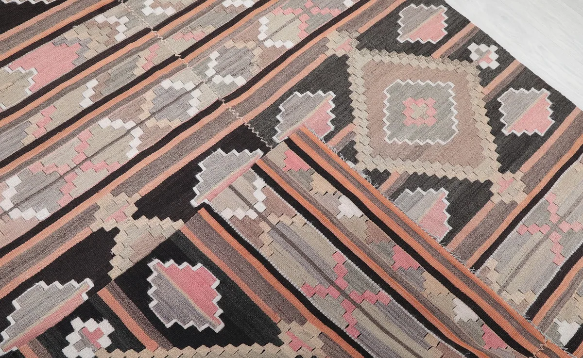 Folded section of the rug, revealing the texture and consistency of the hand-knotted pile