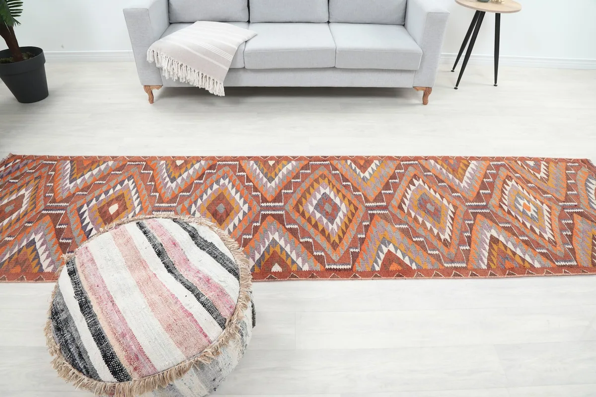Long shot of the runner rug in a room, emphasizing its length and how it complements the space.