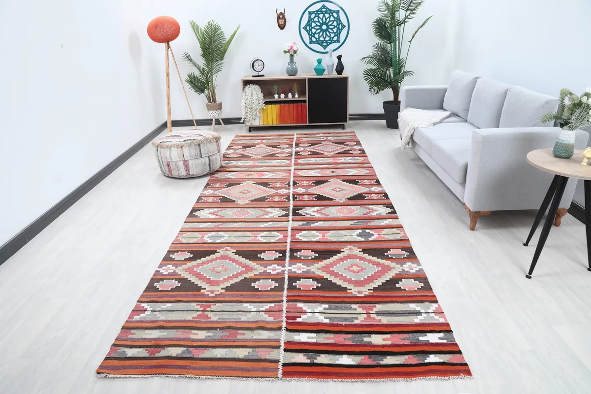 Vintage Anatolian area rug in a modern living room setting with a gray sofa
