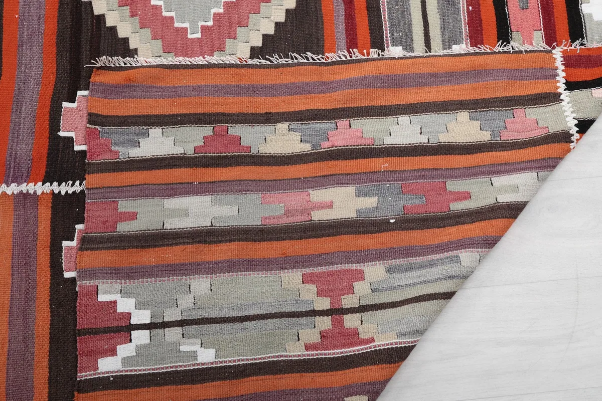 Underside of the rug showing the cotton foundation and hand-knotted construction