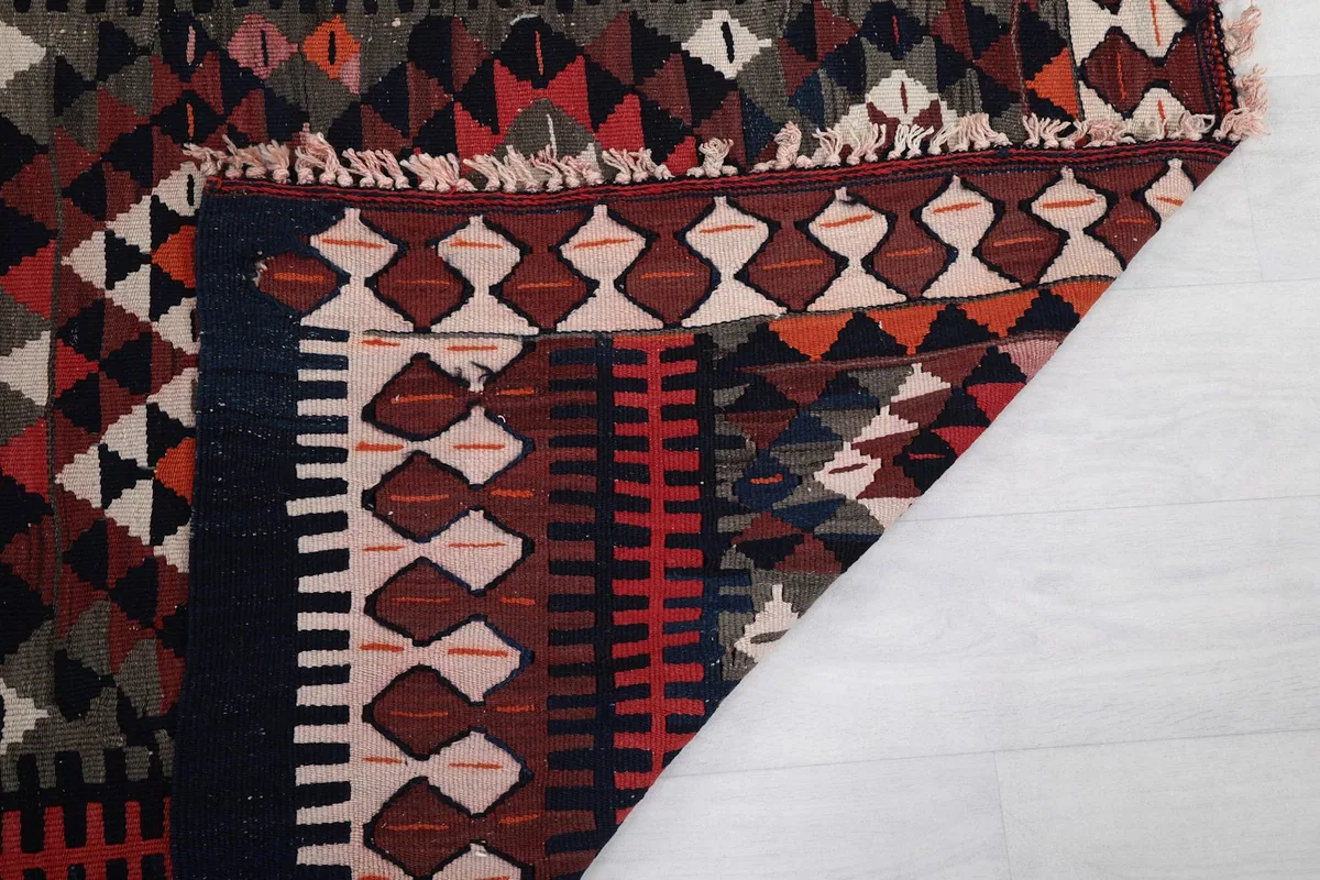 Underside view of the hand-knotted wool pile on cotton foundation