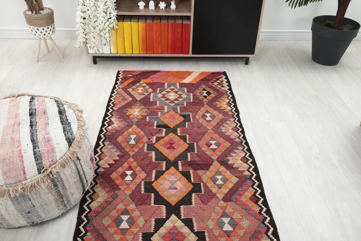 Overhead view of the vintage runner rug in a room, showing its placement in a hallway or entryway