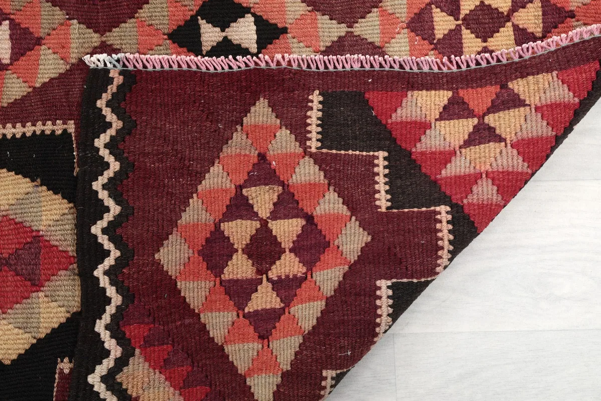 Another view of a folded section, emphasizing the thickness and construction of the rug