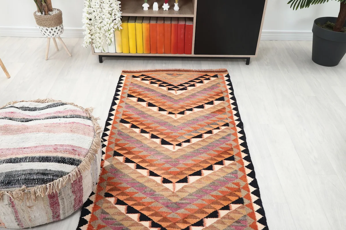 Overhead view of the runner rug in a room setting, showcasing its full design