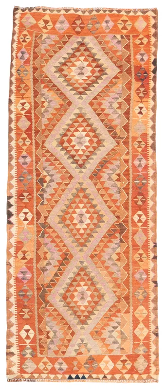 Full overhead view of the orange and beige tribal geometric vintage runner rug