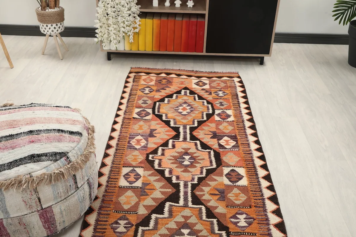 Perspective view of the runner rug stretching through a hallway or entryway