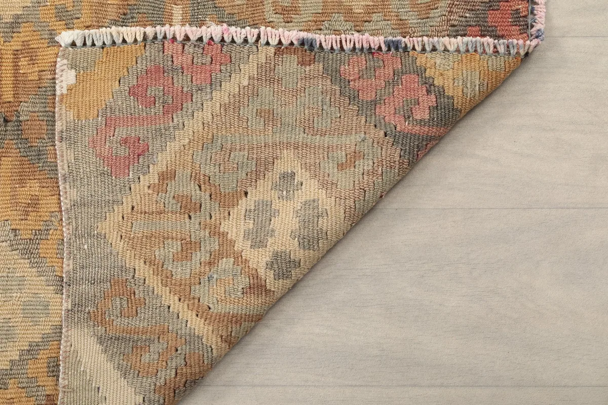 Underside view of the hand-knotted wool pile on a cotton foundation