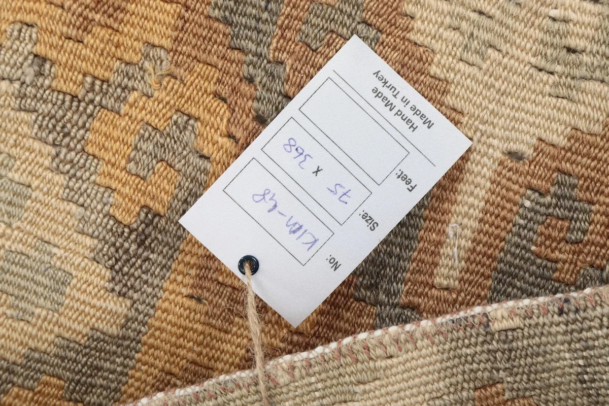 Product tag showing dimensions and origin on the back of the hand-knotted rug