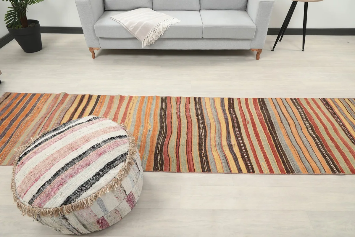 Wide angle room shot of the runner, illustrating its presence and color against light flooring