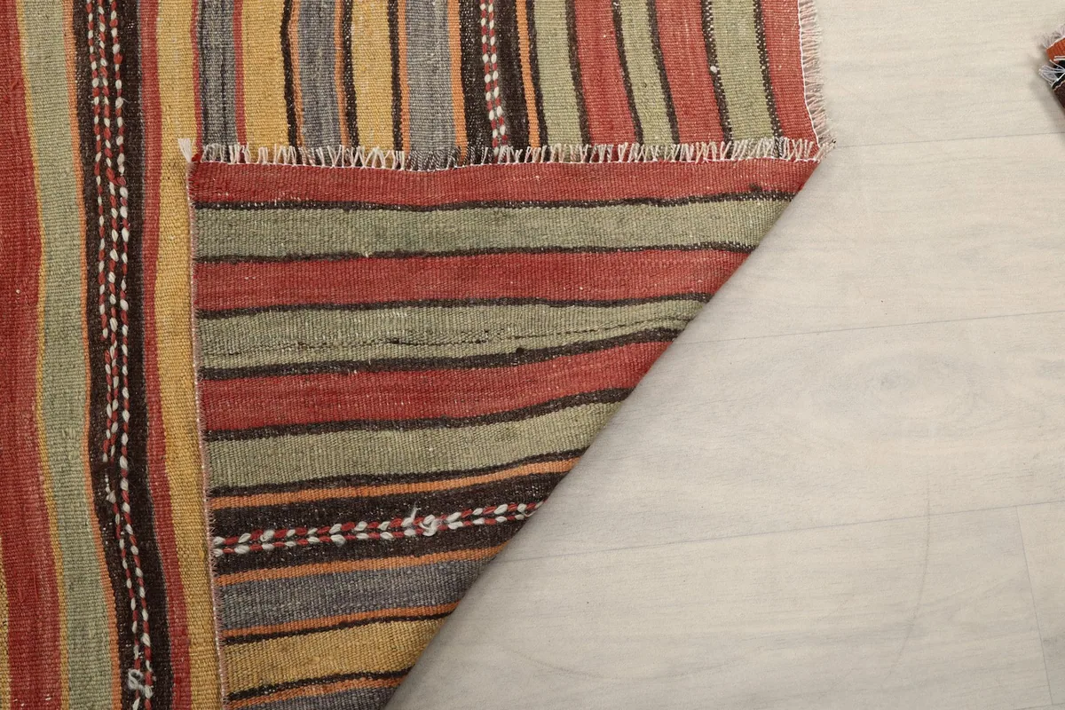 View of the rug's back, revealing the cotton foundation and the neat hand-knotted wool pile