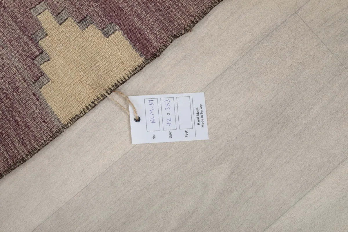 Product tag displaying the rug's dimensions and origin, placed on the back of the rug