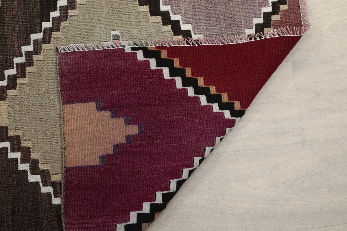 Underside of the runner rug, revealing its sturdy hand-knotted construction