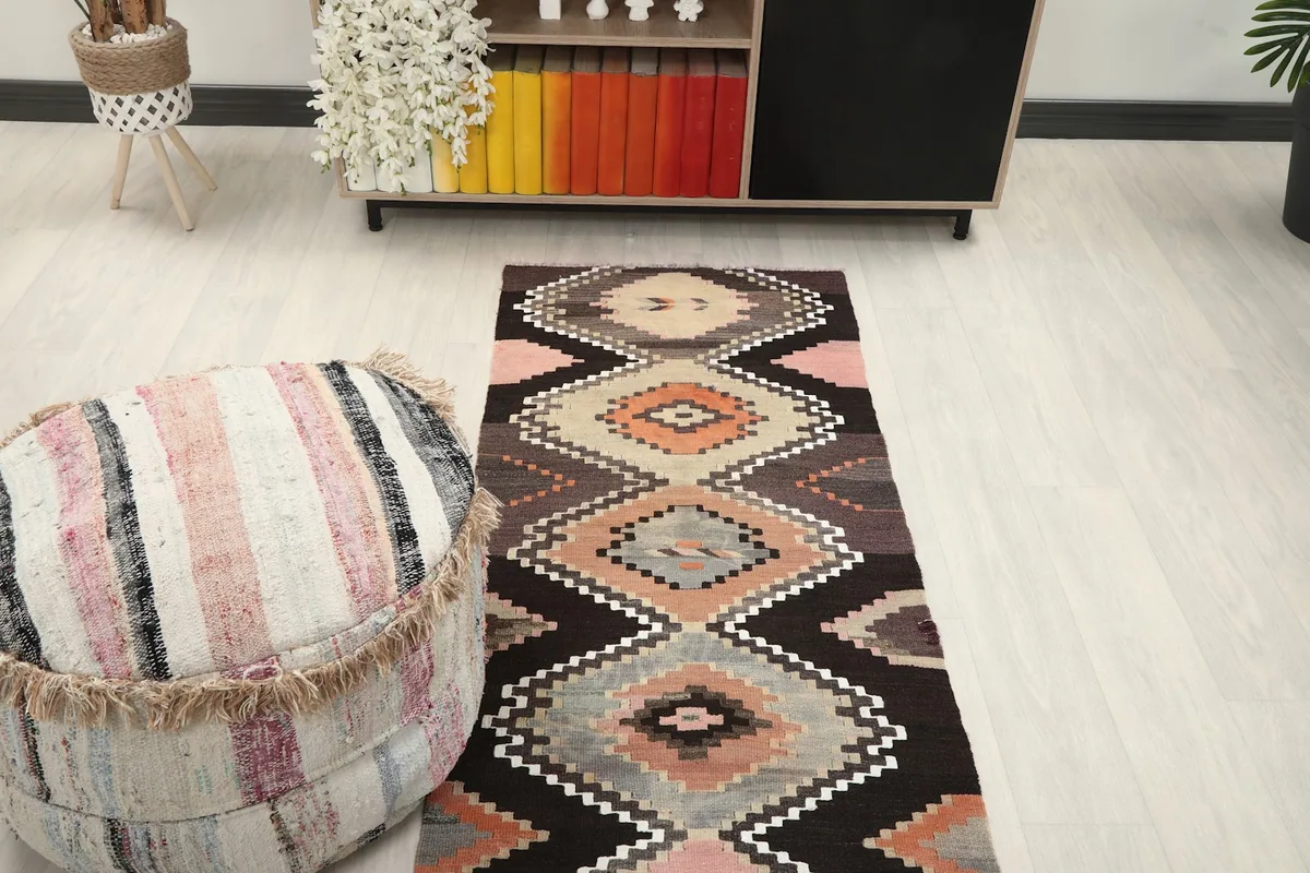 Overhead view of the runner rug in a room, showing its length and geometric design