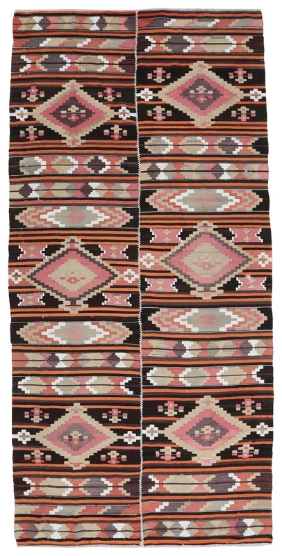 Full top view of the vintage Anatolian rug with black, pink, and orange geometric patterns