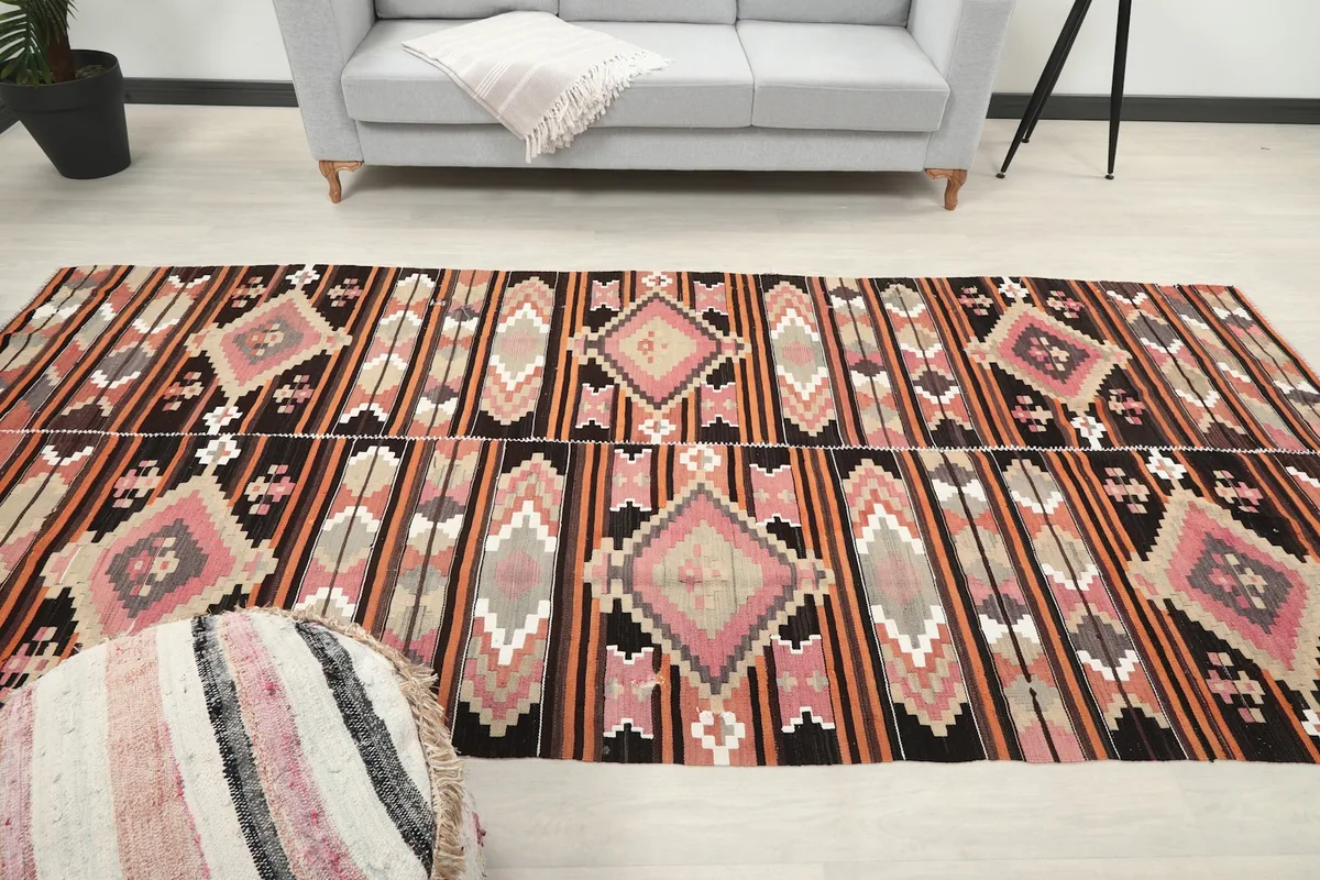 Overhead shot of the rug in a living space, emphasizing its length and pattern repeats