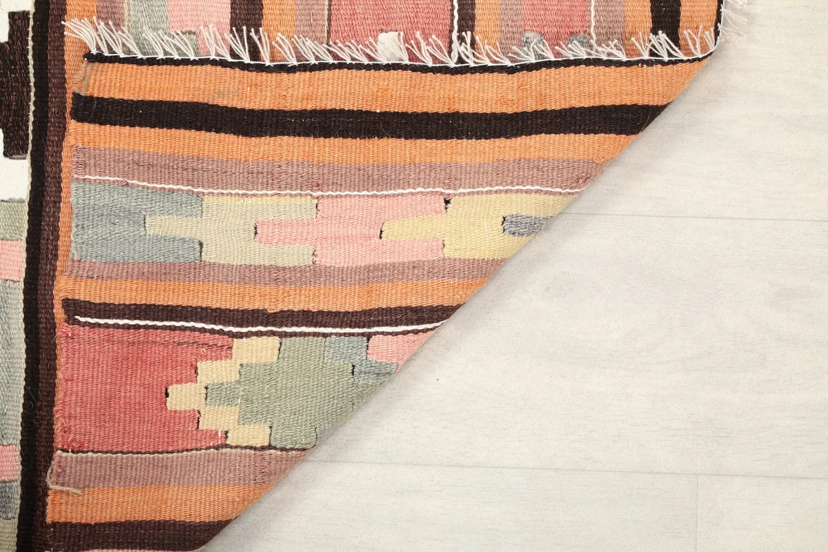 View of the back of the rug, showcasing the tight knotting and cotton foundation
