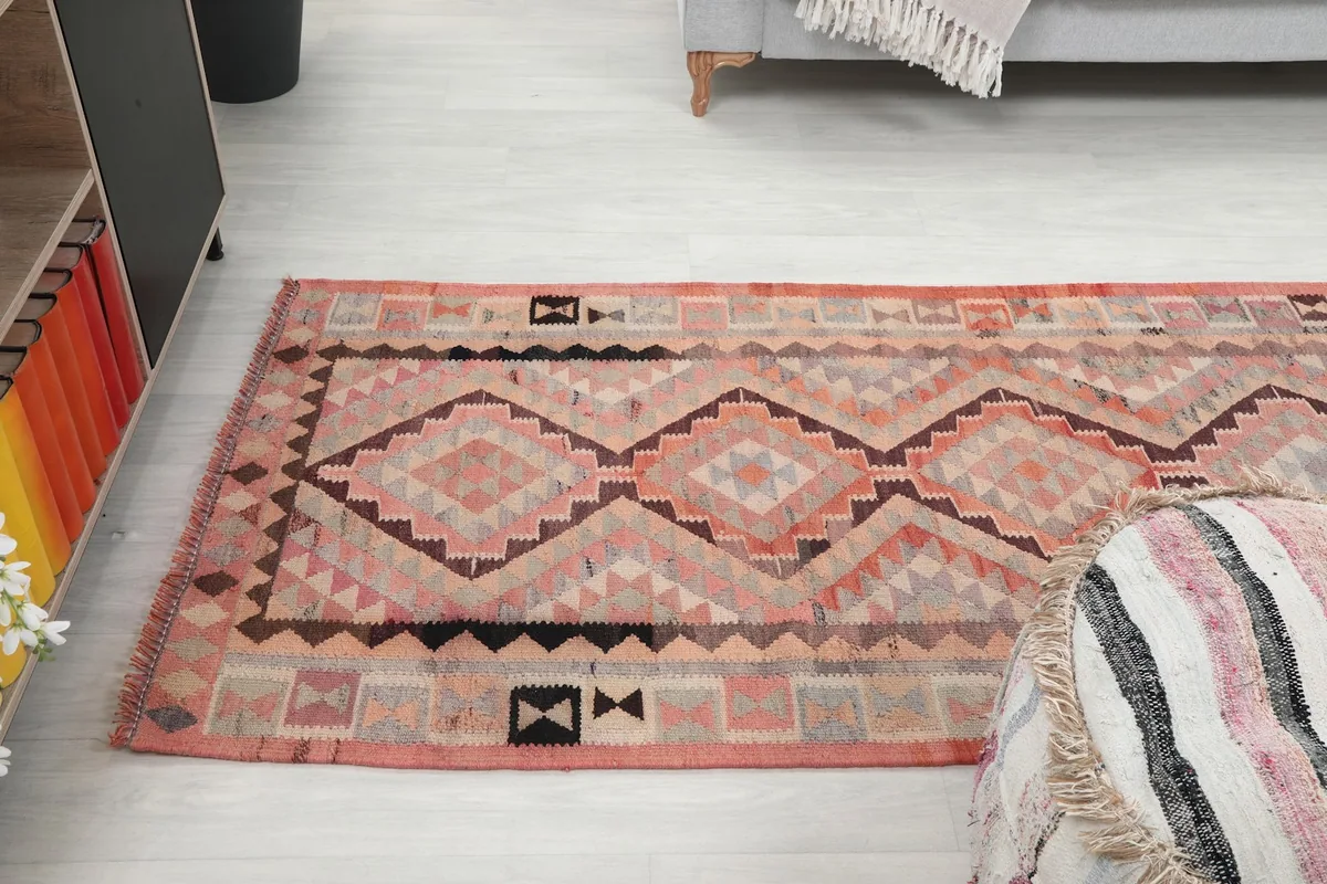 View of the runner from one end, showing the pattern extending down the hallway