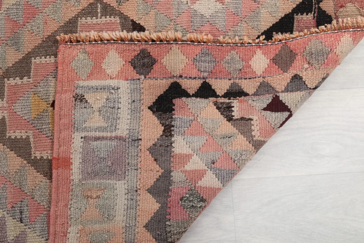 Another folded corner view, showing the rug's thickness and the back of the weave