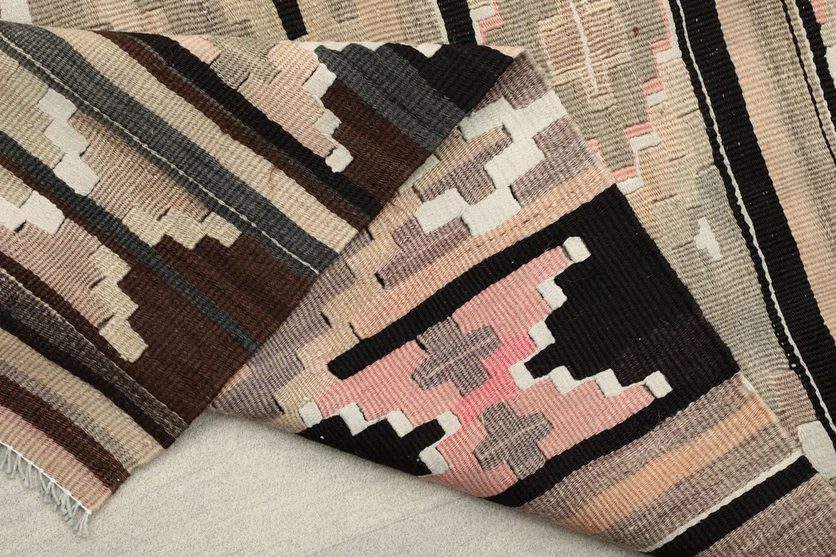 Underside of the rug revealing the cotton foundation and hand-knotted construction