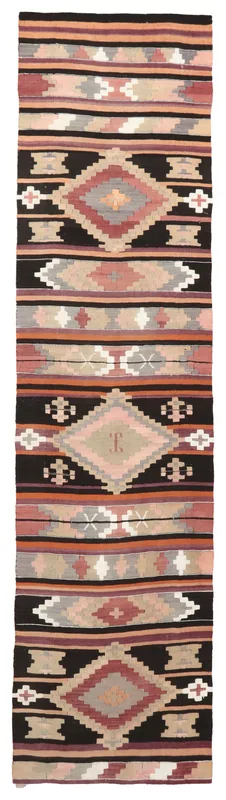 Full top view of the black and rose geometric Anatolian runner on a white background