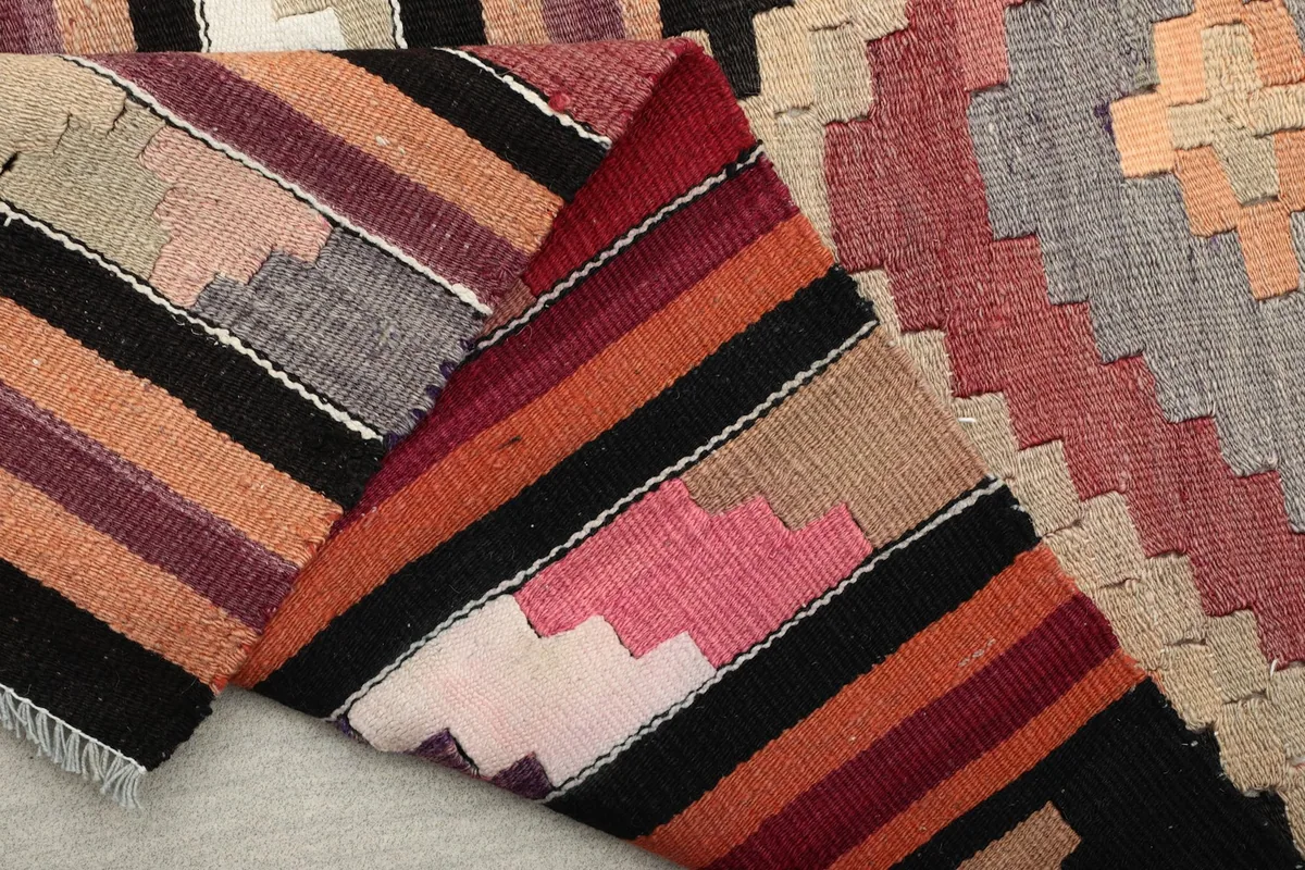 Folded view of the runner, showing the diverse colors and hand-knotted wool texture