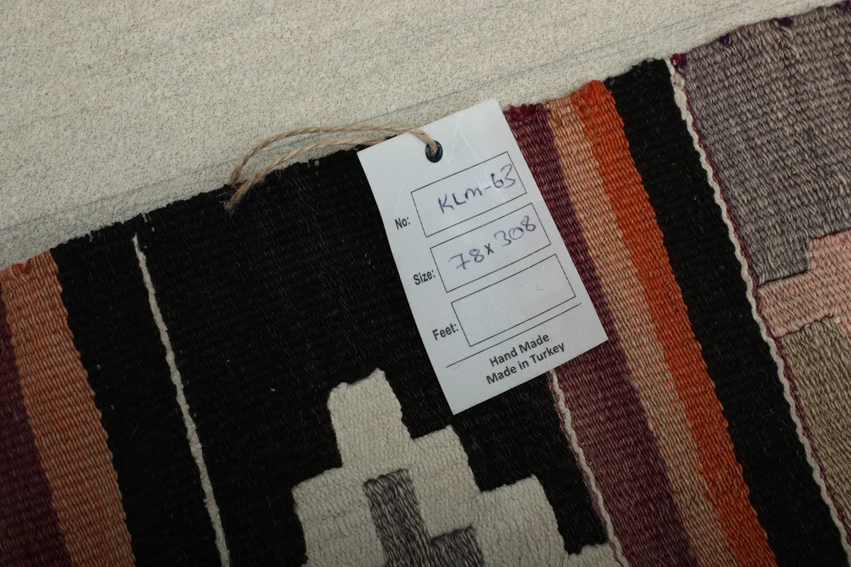 Product tag showing the rug's size 78x308 cm and indicating it is hand made in Turkey